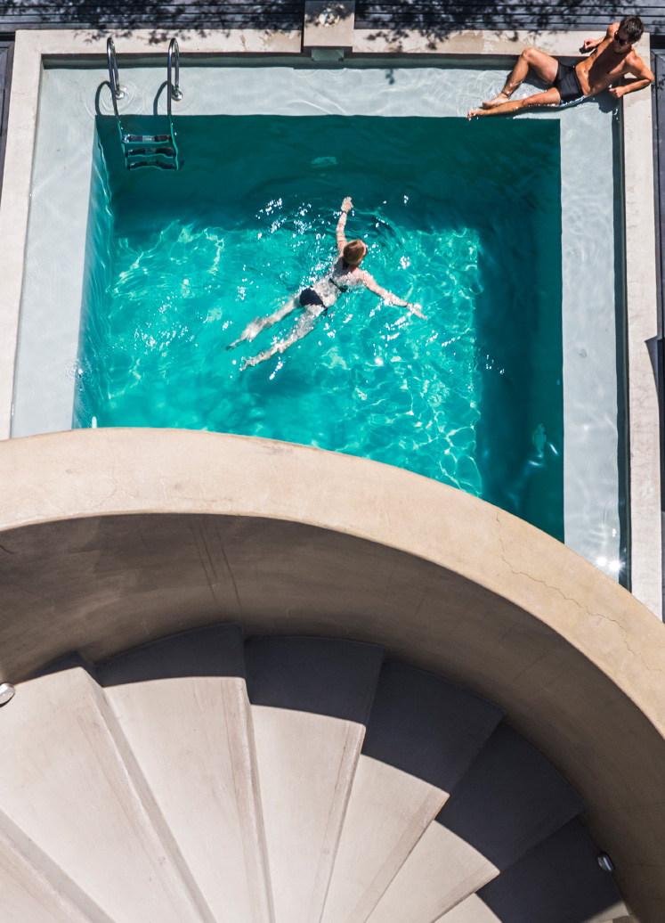 couple at a swimming pool on vacation at luxury UFBSGCD